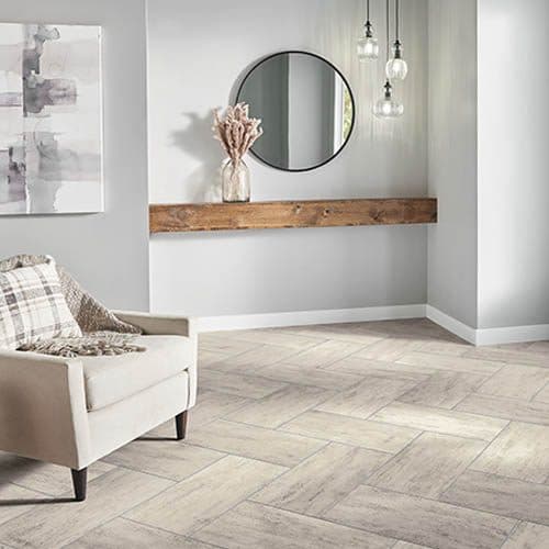 Herringbone tile flooring in a bright entryway